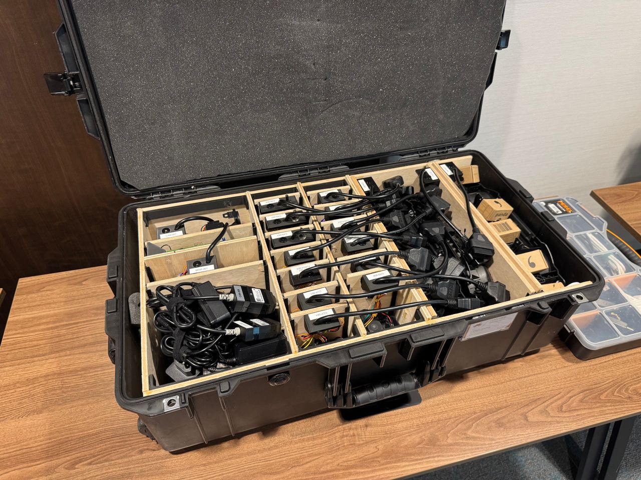 Portable training setups organized in a hard case with adapters and electronics.