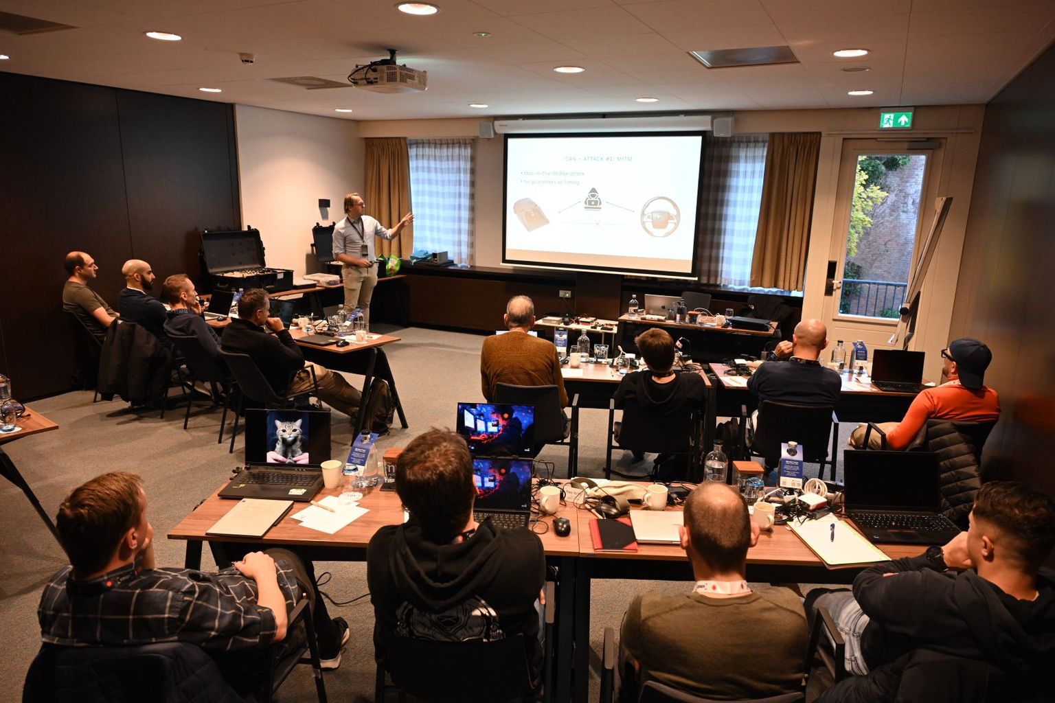 Willem presenting an automotive security training to a room of participants.