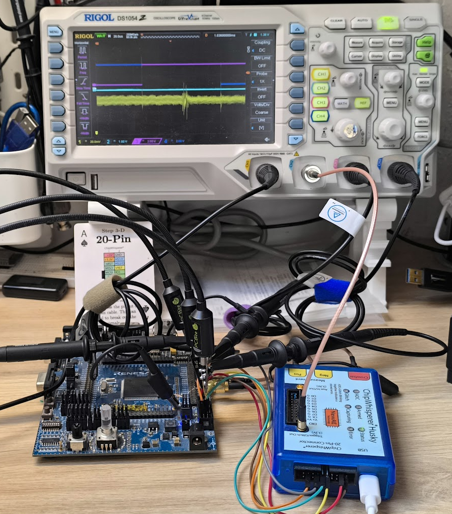 ChipWhisperer Husky connected to an RH850 development board, with the ISOVCL SMA connector used both to inject glitches and to measure the power side channel. Figure from Azalbert, 2026 (Quarkslab RH850 debug password bypass).