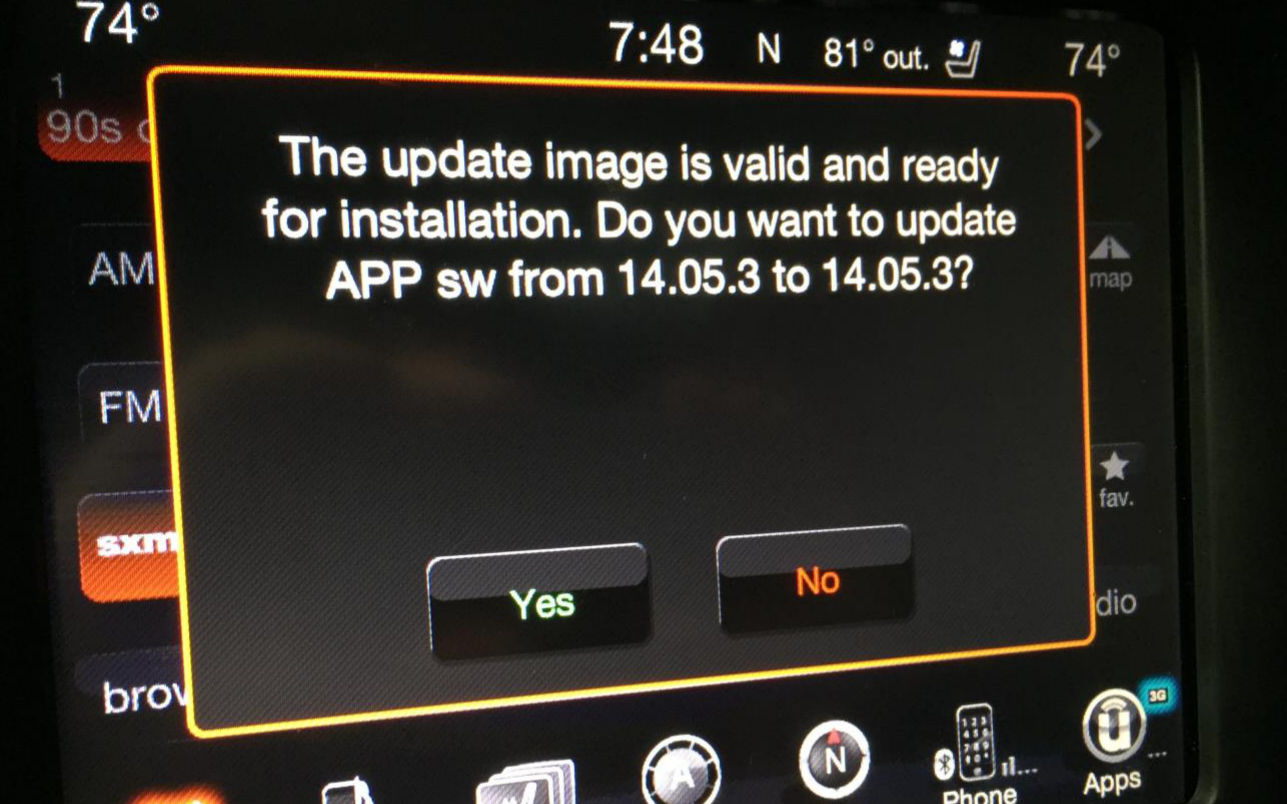 Uconnect touchscreen displaying a firmware update prompt, used in the USB-based jailbreak that established the initial code execution path. Figure from Miller and Valasek, 2015 (Remote Exploitation of an Unaltered Passenger Vehicle).